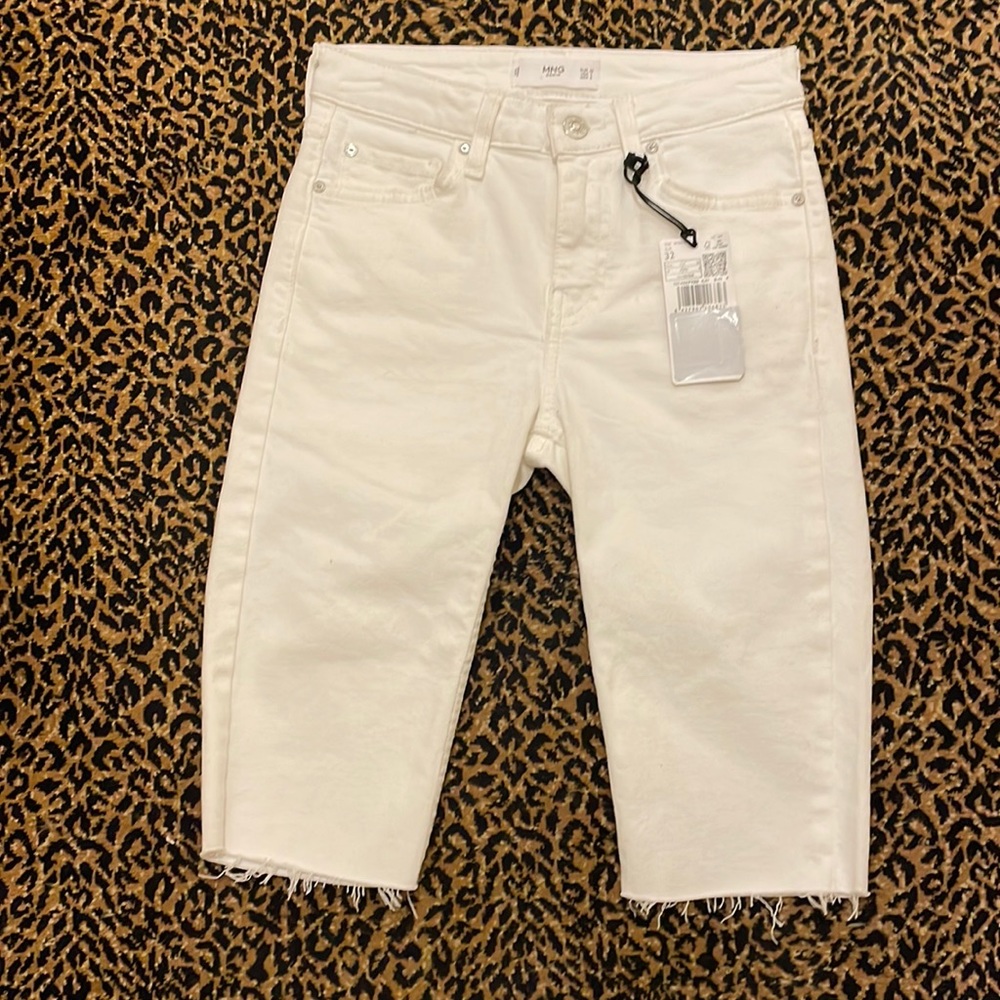 MANGO (MNG)white denim shorts. Raw hem Size label is European. Approx size 24